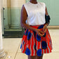 Jupe wax courte aux couleurs bleu, rouge, blanc et noir. Vêtement africain de la boutique africaine MPESA BOUTIQUE